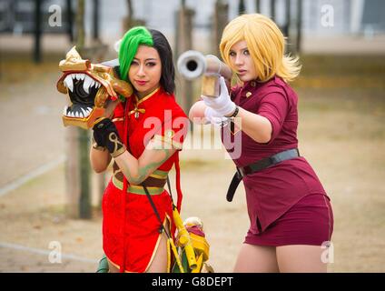 Vivien Yap (left) dressed as Firecracker Jinx, from the League of Legends video game, and Teraana, dressed as Seras Victoria from the Hellsing series at the MCM London Comic Con at ExCeL London. Stock Photo