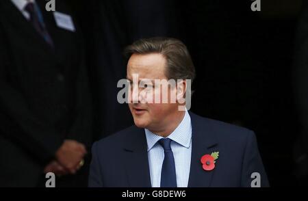 Prime Minister David Cameron leaves after his lunch with China's President Xi Jinping at Manchester Town Hall in Manchester on the last day of his state visit to the UK. Stock Photo