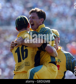 Australia's Brad Hogg (R) celebrates the wicket of England's Andrew Flintoff with Michael Kasprowicz. Stock Photo