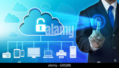Hand pushing virtual security button on digital background Stock Photo