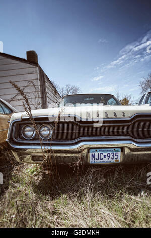 An old American Dodge Charger car left in a yard in Minneapolis, USA. Stock Photo