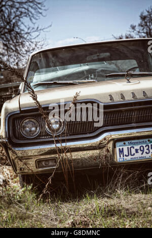 An old American Dodge Charger car left in a yard in Minneapolis, USA. Stock Photo