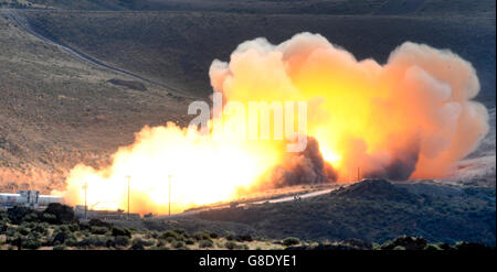 June 28, 2016. Promontory UT. Raw fire power is blasted into a hillside as ATK test fires a solid rocket booster motor that burns 6 tons of propellant each second with expanding gases and flames exiting the nozzle at speeds in excess of Mach 3 and temperatures reaching 3,700 degrees Fahrenheit Tuesday. Orbital ATK test fire happen at 9:05am MT time and NASA will use measurements from more than 530 data channels to evaluate motor performance, acoustics, motor vibrations, nozzle modifications, insulation upgrades. Photo by Gene Blevins/LA DailyNews/ZumaPress. (Credit Image: © Gene Blevins via Stock Photo