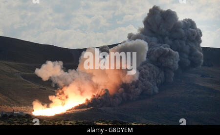 June 28, 2016. Promontory UT. Raw fire power is blasted into a hillside as ATK test fires a solid rocket booster motor that burns 6 tons of propellant each second with expanding gases and flames exiting the nozzle at speeds in excess of Mach 3 and temperatures reaching 3,700 degrees Fahrenheit Tuesday. Orbital ATK test fire happen at 9:05am MT time and NASA will use measurements from more than 530 data channels to evaluate motor performance, acoustics, motor vibrations, nozzle modifications, insulation upgrades. Photo by Gene Blevins/LA DailyNews/ZumaPress. (Credit Image: © Gene Blevins via Stock Photo