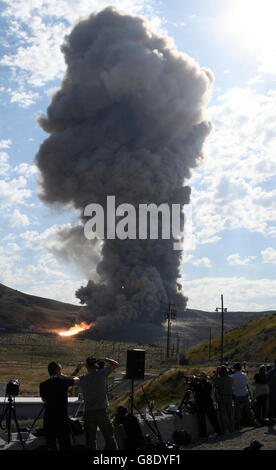 June 28, 2016. Promontory UT. Raw fire power is blasted into a hillside as ATK test fires a solid rocket booster motor that burns 6 tons of propellant each second with expanding gases and flames exiting the nozzle at speeds in excess of Mach 3 and temperatures reaching 3,700 degrees Fahrenheit Tuesday. Orbital ATK test fire happen at 9:05am MT time and NASA will use measurements from more than 530 data channels to evaluate motor performance, acoustics, motor vibrations, nozzle modifications, insulation upgrades. Photo by Gene Blevins/LA DailyNews/ZumaPress. (Credit Image: © Gene Blevins via Stock Photo