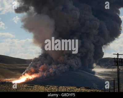 June 28, 2016. Promontory UT. Raw fire power is blasted into a hillside as ATK test fires a solid rocket booster motor that burns 6 tons of propellant each second with expanding gases and flames exiting the nozzle at speeds in excess of Mach 3 and temperatures reaching 3,700 degrees Fahrenheit Tuesday. Orbital ATK test fire happen at 9:05am MT time and NASA will use measurements from more than 530 data channels to evaluate motor performance, acoustics, motor vibrations, nozzle modifications, insulation upgrades. Photo by Gene Blevins/LA DailyNews/ZumaPress. (Credit Image: © Gene Blevins via Stock Photo