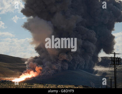 June 28, 2016. Promontory UT. Raw fire power is blasted into a hillside as ATK test fires a solid rocket booster motor that burns 6 tons of propellant each second with expanding gases and flames exiting the nozzle at speeds in excess of Mach 3 and temperatures reaching 3,700 degrees Fahrenheit Tuesday. Orbital ATK test fire happen at 9:05am MT time and NASA will use measurements from more than 530 data channels to evaluate motor performance, acoustics, motor vibrations, nozzle modifications, insulation upgrades. Photo by Gene Blevins/LA DailyNews/ZumaPress. (Credit Image: © Gene Blevins via Stock Photo