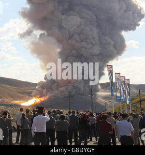 June 28, 2016. Promontory UT. Raw fire power is blasted into a hillside as ATK test fires a solid rocket booster motor that burns 6 tons of propellant each second with expanding gases and flames exiting the nozzle at speeds in excess of Mach 3 and temperatures reaching 3,700 degrees Fahrenheit Tuesday. Orbital ATK test fire happen at 9:05am MT time and NASA will use measurements from more than 530 data channels to evaluate motor performance, acoustics, motor vibrations, nozzle modifications, insulation upgrades. Photo by Gene Blevins/LA DailyNews/ZumaPress. (Credit Image: © Gene Blevins via Stock Photo