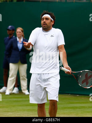 Wimbledon, London, UK. 29th June, 2016. The Wimbledon Tennis Championships Day Three.  Marcos Baghdatis (CYP) complains to the umpire about the slippery conditions after only a few minutes play in his match against number 18 seed, John Isner (USA). The players were forced off court a few minutes later as play on the outside courts was suspended due to rain. Credit:  Action Plus Sports Images/Alamy Live News Stock Photo