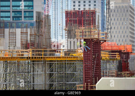 Florida, USA. 29th June, 2016. Construction workers work on a column that will support the parking garage of an apartment building near All Aboard Florida's MiamiCentral station in downtown Miami Wednesday, June 29, 2016. © Bruce R. Bennett/The Palm Beach Post/ZUMA Wire/Alamy Live News Stock Photo