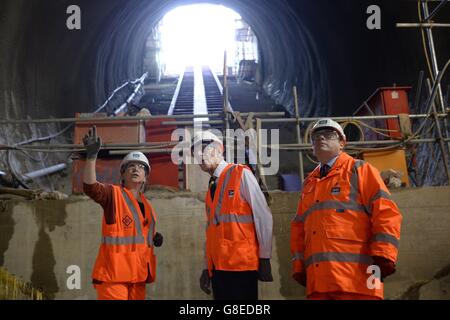 The Duke of Edinburgh is shown an escalator shaft in the new Crossrail station taking shape 30 metres below Farringdon in London by Crossrail Chief Executive Andrew Wolstenholme (right) and Project Manager Linda Miller. Stock Photo