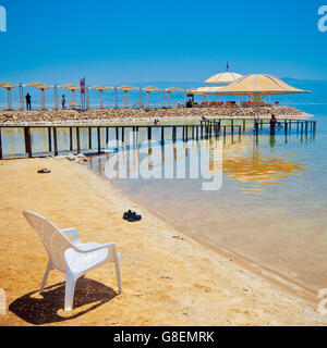 The chair on the shore of Dead Sea in Israel. Stock Photo
