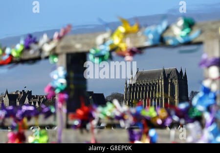 A view of Lancing College Chapel seen through tributes left on the Old Shoreham Tollbridge, near Shoreham, in west Sussex, ahead of a memorial service for the victims of the Shoreham air crash. Stock Photo