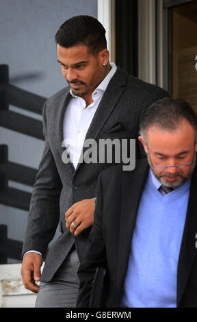 George Kay (left), estranged husband of former Atomic Kitten singer Kerry Katona, leaves Brighton Magistrates Court in Brighton, East Sussex, where he was charged with assaulting her. Stock Photo