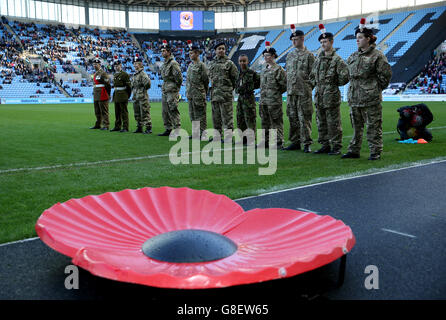 Soccer - Emirates FA Cup - First Round - Coventry City v Northampton Town - Ricoh Arena. Representatives of the armed forces on the pitch for Remembrance Sunday Stock Photo