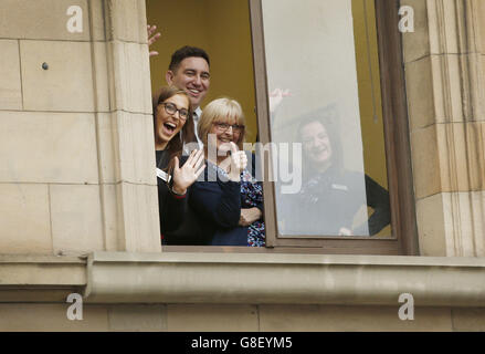 Fans wait for George Clooney in a window in Edinburgh, as he visits Social Bite, a cafe which helps the homeless. Stock Photo