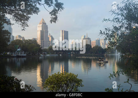 The urban skyline of Bangkok's business district from Lumphini Park Stock Photo