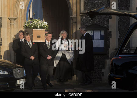 The coffin of former Labour MP Michael Meacher is carried out of St Mary's Church in Wimbledon, London, following his funeral. Stock Photo