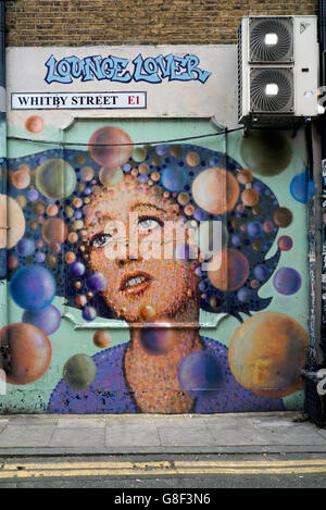 'Lounge Lover' by street artist  James Cochran  in Whitby Street, Shoreditch, East London, UK.