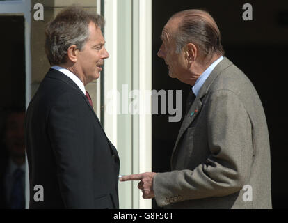 British Prime Minister Tony Blair welcomes French President Jacques Chirac to the first meeting. Stock Photo