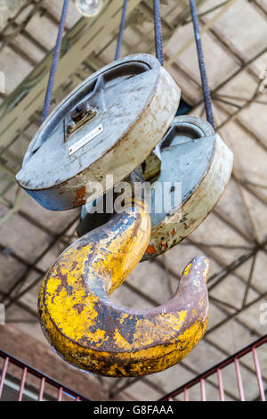 Hook and chains of an old industrial crane, Stock Photo