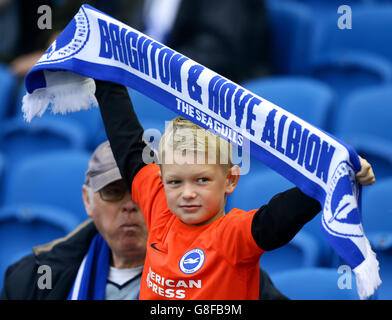 A young Brighton and Hove Albion fan shows his support in the stands Stock Photo