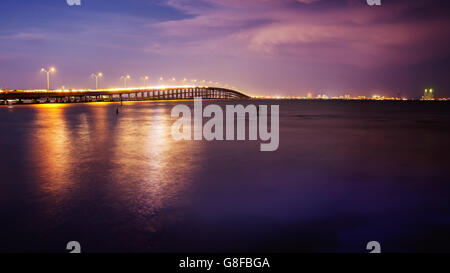 The Queen Isabella Causeway (bridge) leads to South Padre Island, Texas at sunset Stock Photo