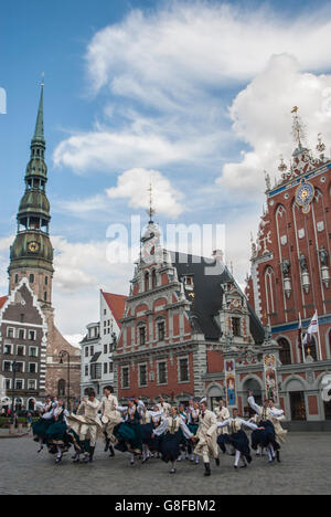 Dancers of old traditional Latvian dance are dancing in the old city center in Riga in Latvia. Stock Photo