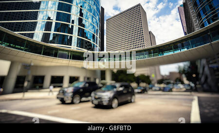 Traffic and modern office buildings in downtown Houston, Texas during the day Stock Photo