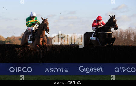Another Hero, (left) ridden by Barry Geraghty jumps the last on the way to winning The Bam Construct Uk Novices' Limited Handicap Chase (Class 3) (4YO plus) during the November Racing Weekend at Ascot Racecourse. Stock Photo