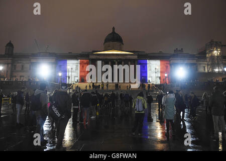 The National Gallery, in London, illuminated with the colours of the French tricolor as London stands in solidarity with its sister European capital in the wake of a series of coordinated terrorist attacks in Paris on Friday night, which left at least 127 people dead and over 200 injured. Stock Photo