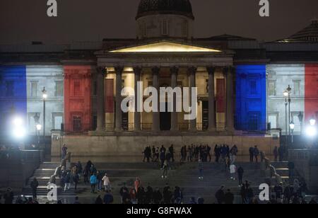 The National Gallery, in London, illuminated with the colours of the French tricolor as London stands in solidarity with its sister European capital in the wake of a series of coordinated terrorist attacks in Paris on Friday night, which left at least 127 people dead and over 200 injured. Stock Photo