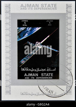 AJMAN STATE - CIRCA 1973: A stamp printed in United Arab Emirates (UAE) shows Explorer 22 / 27 series satellites, circa 1973 Stock Photo