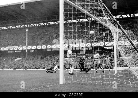 Soccer - World Cup England 1966 - Group Three - Portugal v Brazil - Goodison Park. Portugal's Antonio Simoes (l, behind post) heads the opening goal past Brazil goalkeeper Manga (third l) Stock Photo