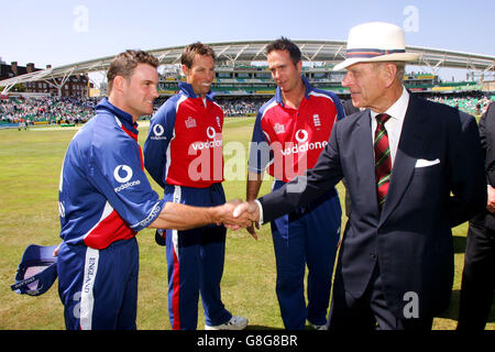 HRH the Duke of Edinburgh meets England's Andrew Strauss introduced by captain Michael Vaughen (behind) Stock Photo
