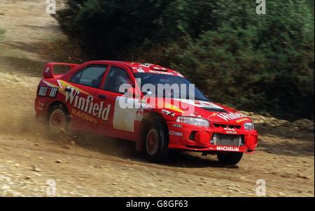 Rallying-Mitsubishi Rally Art Team. Winfield Mitsubishi Lancer EVO IV Rally Car Stock Photo