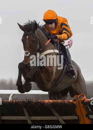 Thistlecrack ridden by Tom Scudamore clears the last flight before going on to win The JLT Long Walk Hurdle Race run during day two of the 2015 Christmas racing weekend at Ascot Racecourse, Ascot. Stock Photo