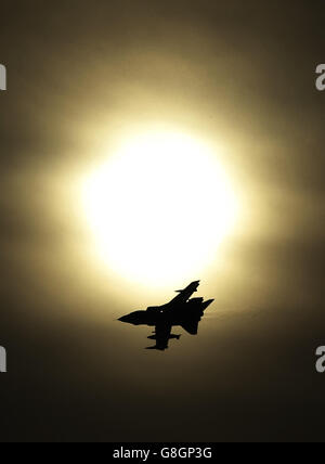 A Tornado jet flying past the sun after taking off from RAF Lossiemouth in Scotland, as RAF Tornado jets carried out the first British bombing runs over Syria, the Ministry of Defence has confirmed. Picture date: Thursday December 3, 2015. The air strikes were carried out within hours of a vote by MPs in the Commons to back extending operations against Islamic State (IS) from neighbouring Iraq. See PA story POLITICS Syria. Photo credit should read: Danny Lawson/PA Wire