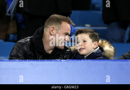 Manchester United's Wayne Rooney with his son Kai during the Barclays Premier League match at Goodison Park, Liverpool. Stock Photo