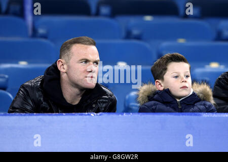 Manchester United's Wayne Rooney with his son Kai during the Barclays Premier League match at Goodison Park, Liverpool. Stock Photo