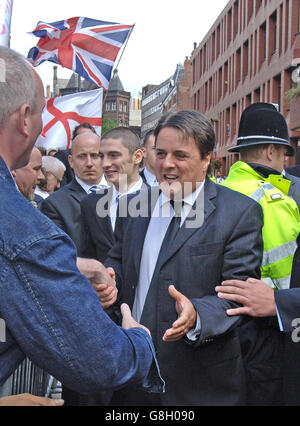 BNP Leader Nick Griffin leaves court. Griffin pleaded not guilty to four race hate charges arising out of an undercover documentary about the party. Griffin appeared alongside party activist Mark Collett, who denies eight similar charges. Both men were charged following a police investigation stemming from the broadcast of the BBC Secret Agent programme. Stock Photo