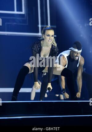 Perrie Edwards of Little Mix performs on stage during the Capital FM Jingle Bell Ball 2015 held at The O2 Arena, London Stock Photo