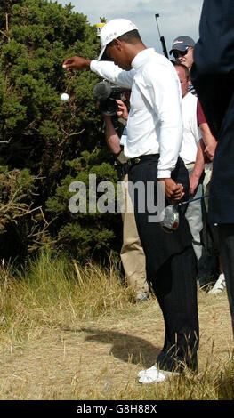 Golf - 134th Open Championship 2005 - Day 3 - The Old Course, St Andrews. USA's Tiger Woods drops his ball after driving into rough on the sixth fairway. Stock Photo