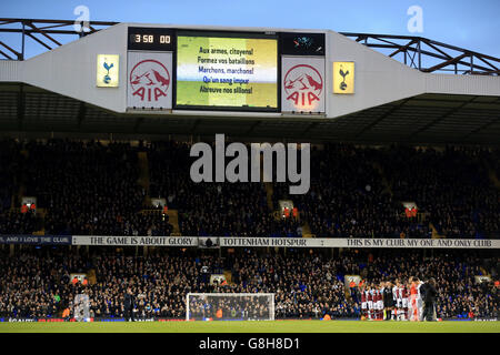 Tottenham Hotspur v West Ham United - Barclays Premier League - White Hart Lane. The words for La Marseillaise are shown on the big screen as the fans sing it before the game Stock Photo