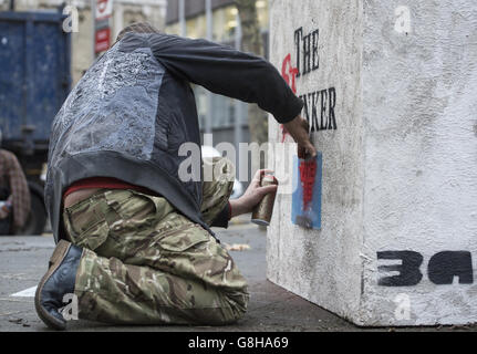 AK 47 returns Banksy's sculpture 'The Drinker' as 'The Stinker' to Shaftesbury Avenue in London 'with some notable amendments' a decade after being removed. Stock Photo