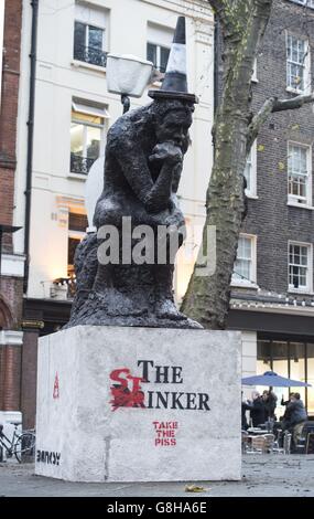 EDITORS NOTE CONTENT Banksy's sculpture 'The Drinker' has been returned as 'The Stinker' to Shaftesbury Avenue in London 'with some notable amendments' a decade after being removed. Stock Photo