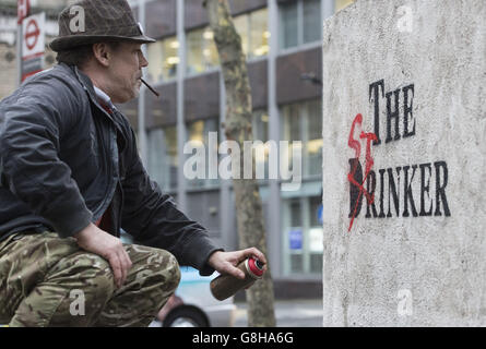 AK 47 returns Banksy's sculpture 'The Drinker' as 'The Stinker' to Shaftesbury Avenue in London 'with some notable amendments' a decade after being removed. Stock Photo