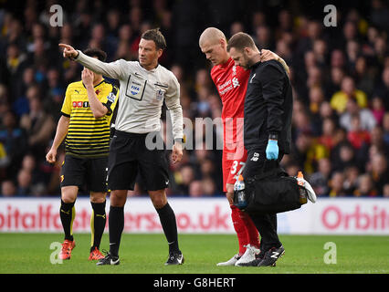 Referee Mark Clattenburg, left, gestures besides Chile's Arturo Vidal ...