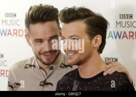 (from left) Liam Payne and Louis Tomlinson of One Direction arrive on the red carpet for the BBC Music Awards at the Genting Arena, Birmingham. Stock Photo