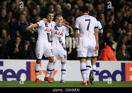 Tottenham Hotspur's Erik Lamela (left) celebrates scoring their second goal of the game with team-mate Kieran Trippier (centre) during the UEFA Europa League match at White Hart Lane, London. Stock Photo